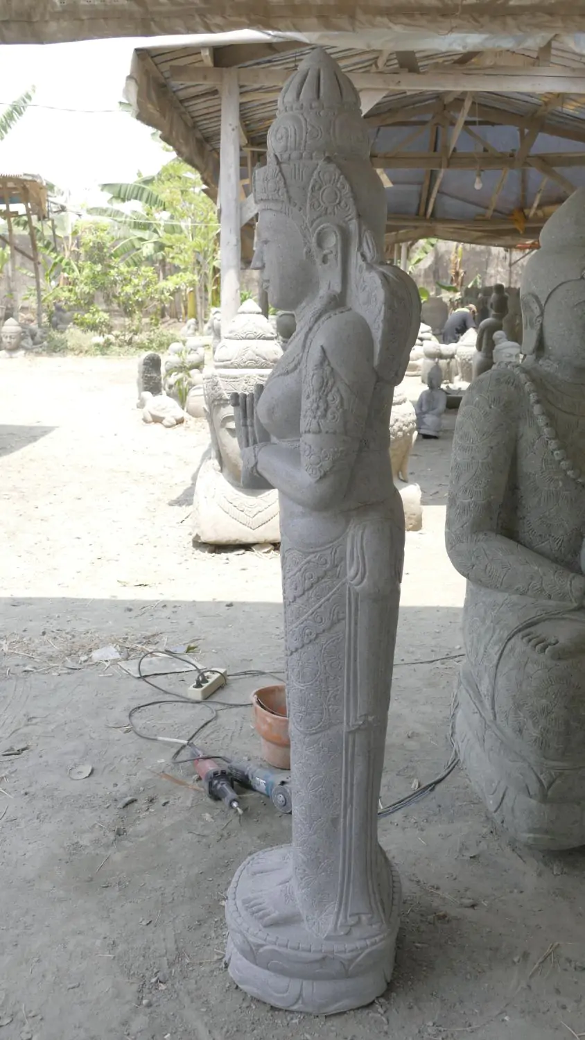  Product image 4 of the product “Standing Sri Dewi. Made from riverstone. Height 180cm ”